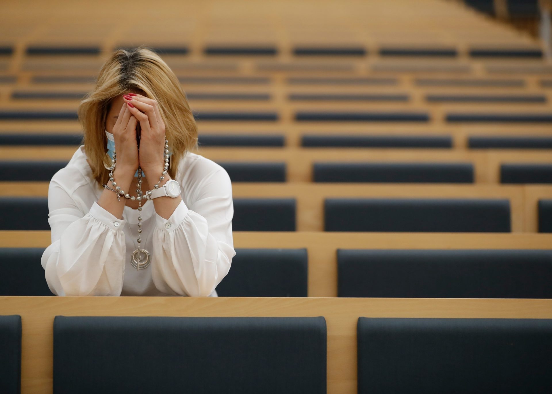 A woman in quiet prayer in Fátima