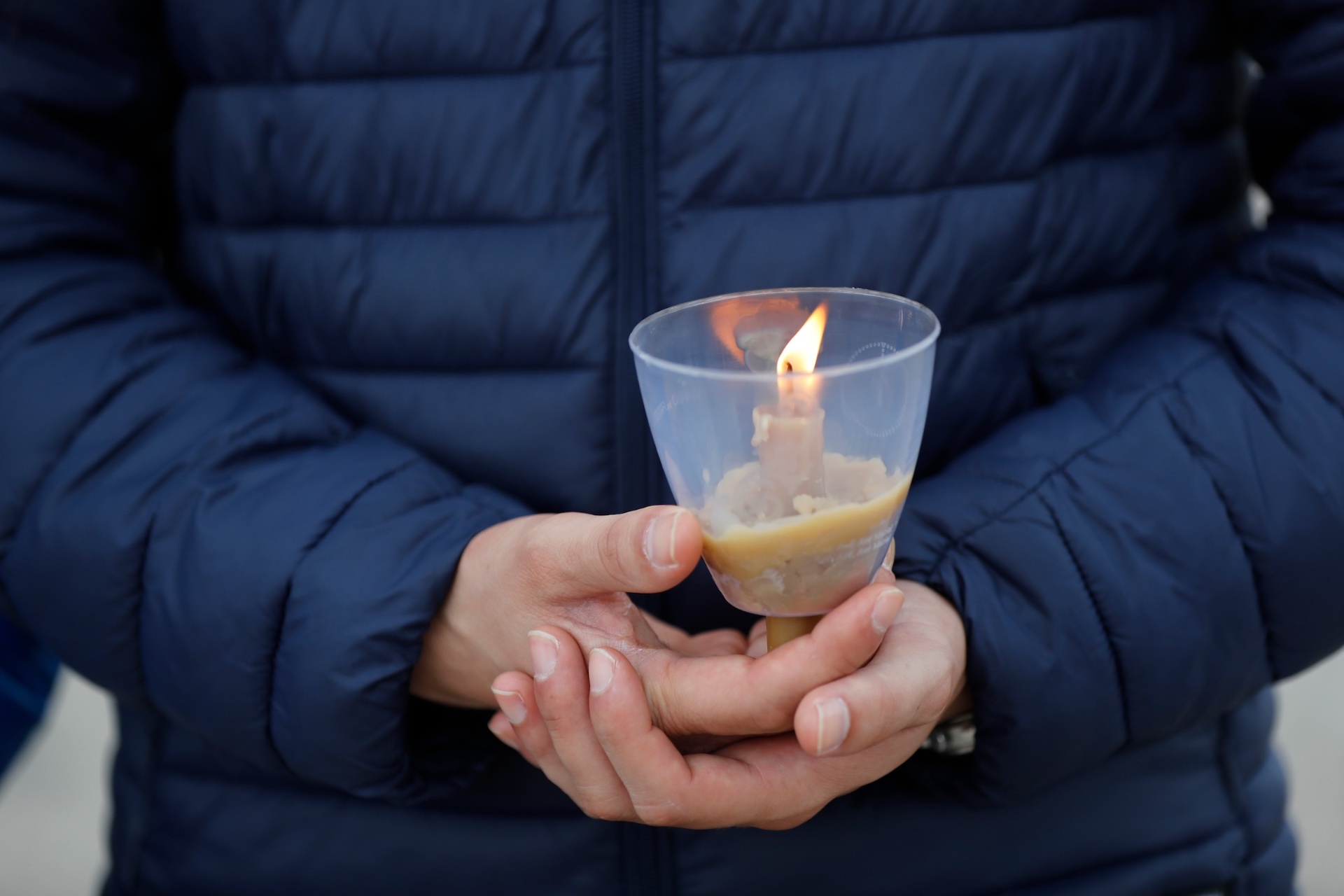 Pilgrim holding a candle at Fátima